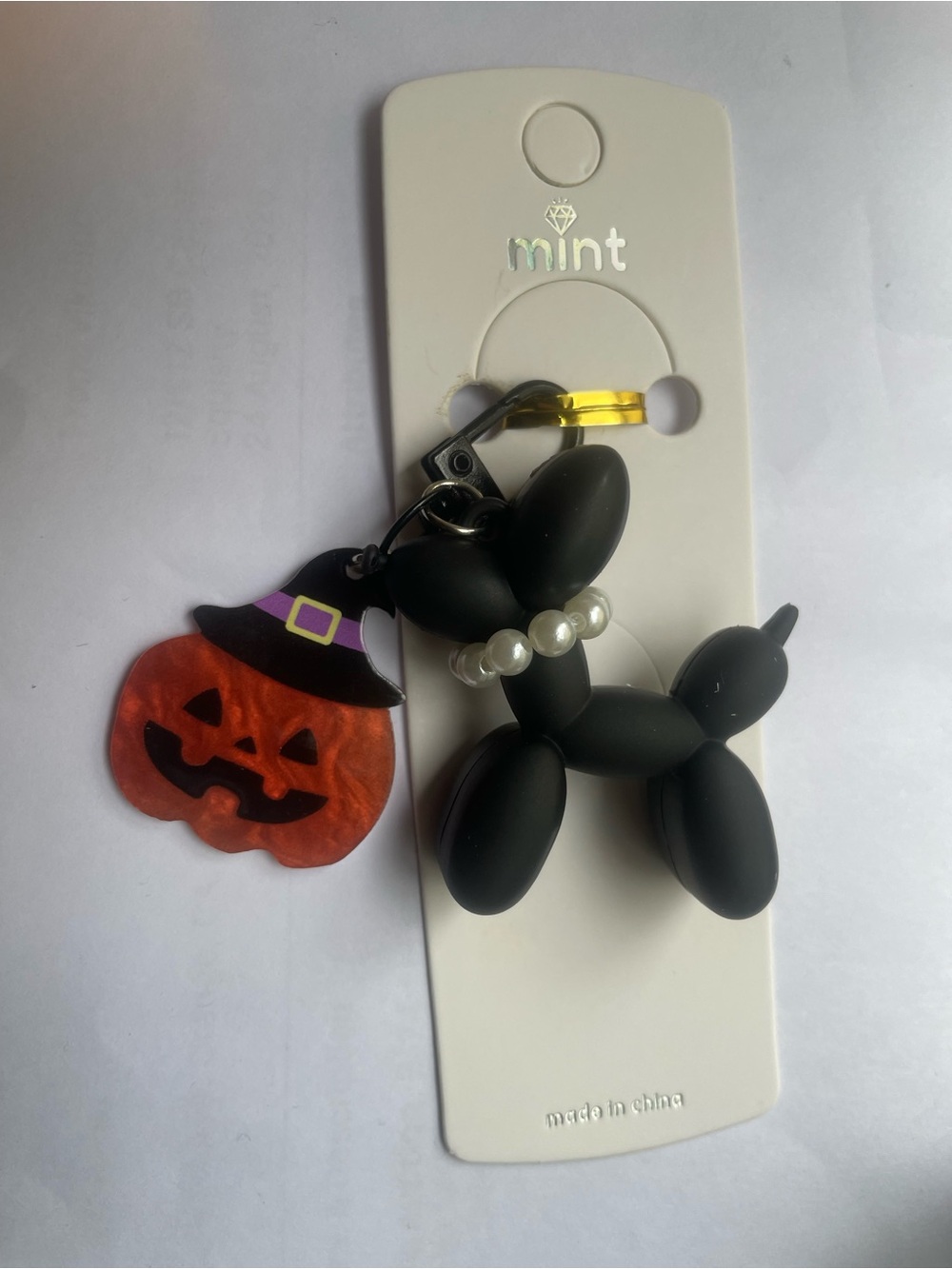 Mint Black Balloon Dog Keychain with Orange Jack-o'-Lantern Charm